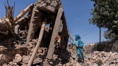 A villager in the rubble of destroyed buildings in El Haouz region of Morocco. Bloomberg