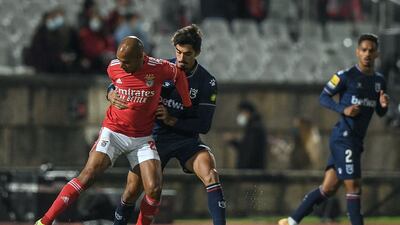 Benfica's Portuguese midfielder Joao Mario is challenged by Belenenses' Portuguese midfielder Rafa Santos. AFP