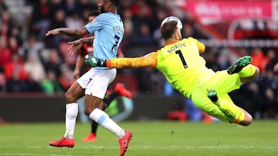 Artur Boruc of AFC Bournemouth dives to make a save infront of Raheem Sterling of Manchester City. Getty Images