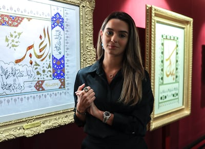 Rayan Hakki is the general manager of Khawla Art and Culture. The works of Sheikha Khawla appear in the background. Victor Besa / The National