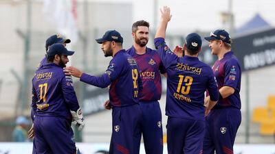 Ben Cutting, centre, of Deccan Gladiators celebrate the wicket of Luke Ronchi at the Sheikh Zayed Cricket Stadium in Abu Dhabi. Pawan Singh / The National
