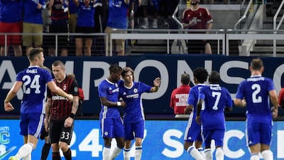 Chelsea players celebrate with Oscar after the midfielder scored his second and Chelsea’s third goal. Hannah Foslien / Getty Images