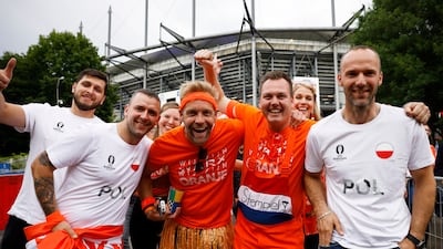 Netherlands and Poland fans mix outside the stadium. Reuters