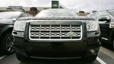 A Land Rover vehicle appears in the parking lot of a dealership in Norwood, Mass., on March 26 2008. Ford Motor Co. is selling its storied Jaguar and Land Rover businesses to India's Tata Motors Ltd. in a deal that will net the U.S. automaker $1.7 billion, roughly a third of the price it paid for the two luxury brands. (AP Photo/Steven Senne)