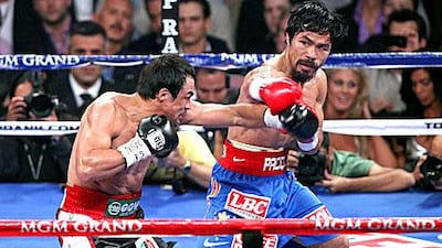 Manny Pacquiao, right, and Juan Manuel Marquez clash in Las Vegas with the Filipino winning on a points decision to retain his WBO Welterweight title.