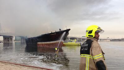 Flames spread from one dhow, which reportedly just returned from Iran, to two other vessels. Antonie Robertson / The National