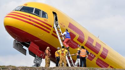 A DHL cargo plane that broke in two after it skidded off the runway at Juan Santamaria airport, Costa Rica. The Boeing 757 returned to the airport after experiencing problems on take-off. AFP