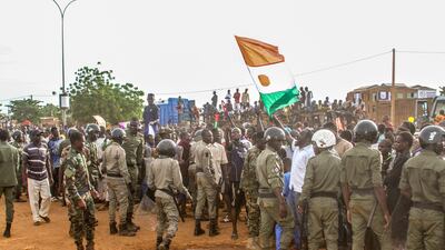 Niger's junta supporters take part in a demonstration in front of a French army base in Niamey. Reuters