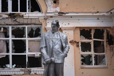 A damaged monument to the Soviet Union's founder Vladimir Lenin stands in a central square in Sudzha, in the Kursk region of Russia. AP
