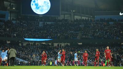 A large 'Blue Moon' image is shown on the large screen after Manchester City defeated Liverpool in their English Premier League soccer match. AP