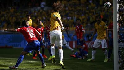 Brazil's David Luiz scores against Chile to make it 1-0 during their match at the 2014 World Cup on Saturday in Belo Horizonte, Brazil. Toru Hanai / Reuters