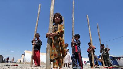 Displaced Iraqi children playing at Al Khazir camp for the internally displaced, located between Arbil and Mosul on June 5, 2017. Karim Sahib/AFP