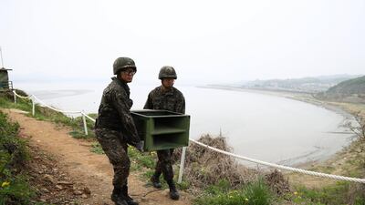 South Korean soldiers take down a propaganda loudspeaker on the border with North Korea in Paju, South Korea. Chung Sung-Jun / EPA