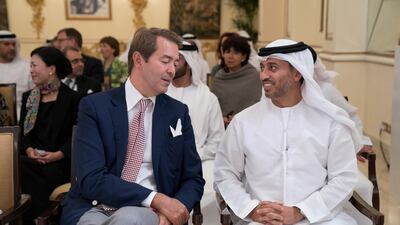 Dr Ahmed Abdullah Humaid Belhoul Al Falasi, UAE Minister of State for Higher Education, right, attends an MOU signing, during a Sea Palace barza. Hamad Al Kaabi / Crown Prince Court - Abu Dhabi