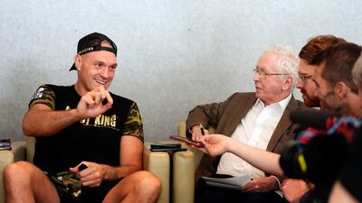 Tyson Fury speaks to journalists during media day in Riyadh. PA