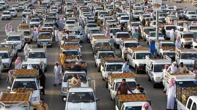 Customers browse from vehicle to vehicle as they shop for dates during the Festival of Dates at Buraidah, north of Riyadh, Saudi Arabia. Fahad Shadeed / Reuters