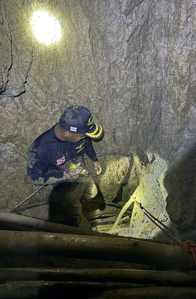 The search continues for the seven trapped men. EPA