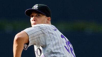 Ubaldo Jimenez shook hands with teammates and left the dugout, after allowing four earned runs and four walks in the first inning against San Diego on Saturday, while his move to Cleveland was being negotiated.