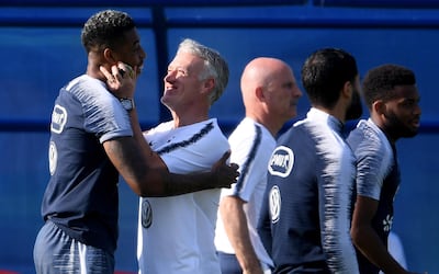 Didier Deschamps jokes with Presnel Kimpembe during France's Friday training session. Getty Images