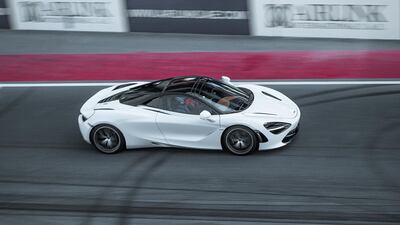 A McLaren GT tears up the Dubai Autodrome straight.