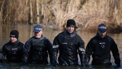 Police search teams work their way through Mount Pond on Clapham Common. Getty Images