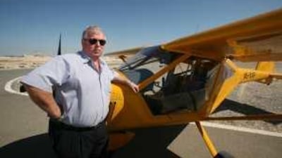Phil Keating with his microlight plane at Al Jazeera Aviation Club in November 2008.