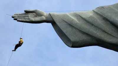 A worker rappels from the Cristo Redentor statue at the Corcovado in Rio de Janeiro. Alessandro Garofalo / Reuters