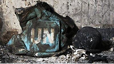 A burnt bullet proof vest and a helmet are seen in a destroyed guesthouse in Kabul that left five UN staffers dead in October last year.