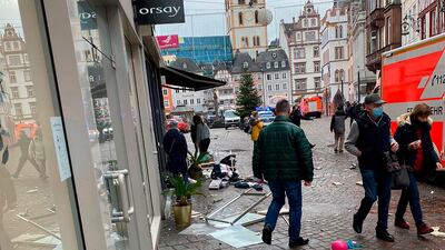 Police cars and ambulances are seen at the scene. At least two people were killed and several injured. AFP