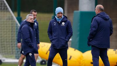 City manager Pep Guardiola with his coaching staff. Reuters