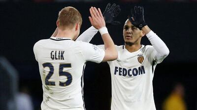 Monaco's Fabinho celebrates with his team mate Kamil Glik after scoring against Guingamp. Stephane Mahe / Reuters