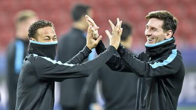 Barcelona's Lionel Messi, right, jokes with Neymar during the final training session at the BayArena prior the Champions League group E soccer match between Bayer Leverkusen and FC Barcelona in Leverkusen, Germany, Tuesday, Dec. 8, 2015. (AP Photo/Martin Meissner)