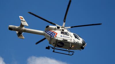 A Belgian police helicopter flies overhead. Reuters