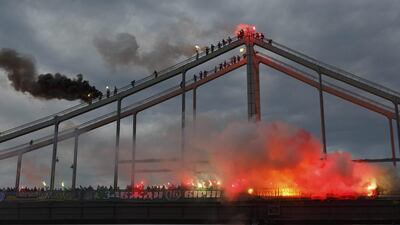 Football fans burn torches on a bridge in Kiev, Ukraine. About two thousand football fans of six Ukrainian clubs burn flares for support of Single Ukraine at a bridge across Dnieper River. Iron Moroz / EPA
