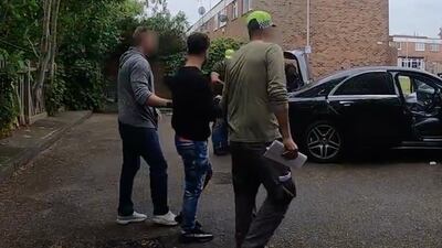 Hewa Rahimpur, originally from Iran but now living in Ilford, is detained in an operation in East London. PA