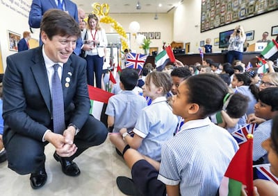 British Ambassador, Patrick Moody, chats with a student during the anniversary event. Victor Besa / The National