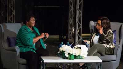 Oprah Winfrey interviews Ms Abrams in front of an audience at the Cobb Civic Centre in Marietta, Georgia. Getty