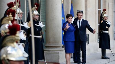 France's president Emmanuel Macron welcomes Polish prime minister Beata Szydlo, centre left, prior to a meeting, at the Elysee Palace, in Paris. Thibault Camus / AP Photo