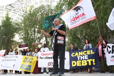 Campaigners demand action on climate change and to cancel debt for poor countries on day eight of Cop28. Francois Nel / Getty Images