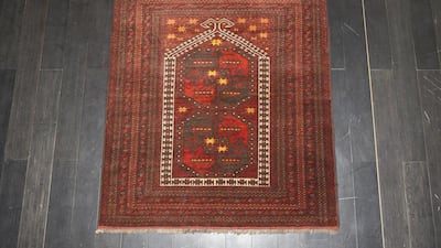 Afghan Qizilayak prayer rug, 70-80 years old. Antonie Robertson / The National