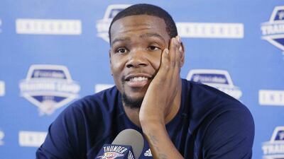 Oklahoma City Thunder forward Kevin Durant answers questions at a press conference on Tuesday. The reigning MVP is expected to miss 6-8 weeks with a fracture in his foot. Sue Ogrocki / AP / October 21, 2014