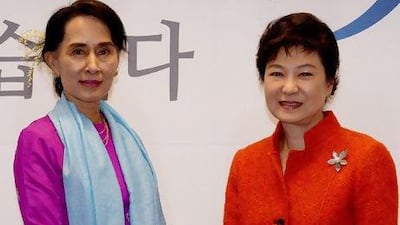 South Korean president-elect Park Geun-hye (right) shakes hands with visiting Myanmar opposition leader Aung San Suu Kyi during a meeting in Seoul.