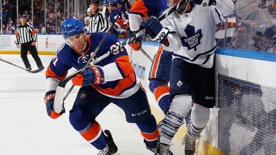 New York Islanders’ John Tavares, left, is off to a fast start, but questions remain about the Islanders’ goaltending. Bruce Bennett / Getty Images