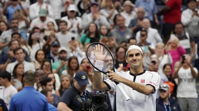 Roger Federer applauds the crowd at Arthur Ashes Stadium after defeating Damir Dzumhur 3-6, 6-2, 6-3, 6-4. EPA