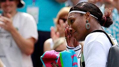 Serena Williams wipes away the tears after her emotional victory over Aravane Rezai yesterday.