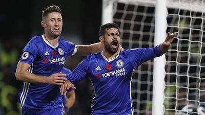 Chelsea’s Diego Costa, right, celebrates scoring the third goal with teammate Gary Cahill. Kirsty Wigglesworth / AP Photo