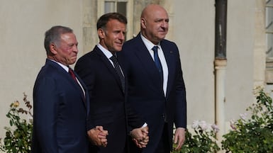 King Abdullah II, left, Emmanuel Macron, centre, and Joseph Aoun before their meeting in Paris. Reuters