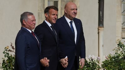 King Abdullah II, left, Emmanuel Macron, centre, and Joseph Aoun before their meeting in Paris. Reuters