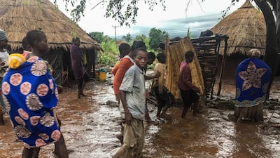 Inhabitants of Chiluvi, a village in central Mozambique, walk along a flooded and muddy street after Cyclone Idai and Floods that hit the region, in Nhamatanda, Mozambique. EPA