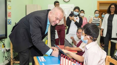 The company's chief executive, James Lafferty, meets students with cerebral palsy at the centre